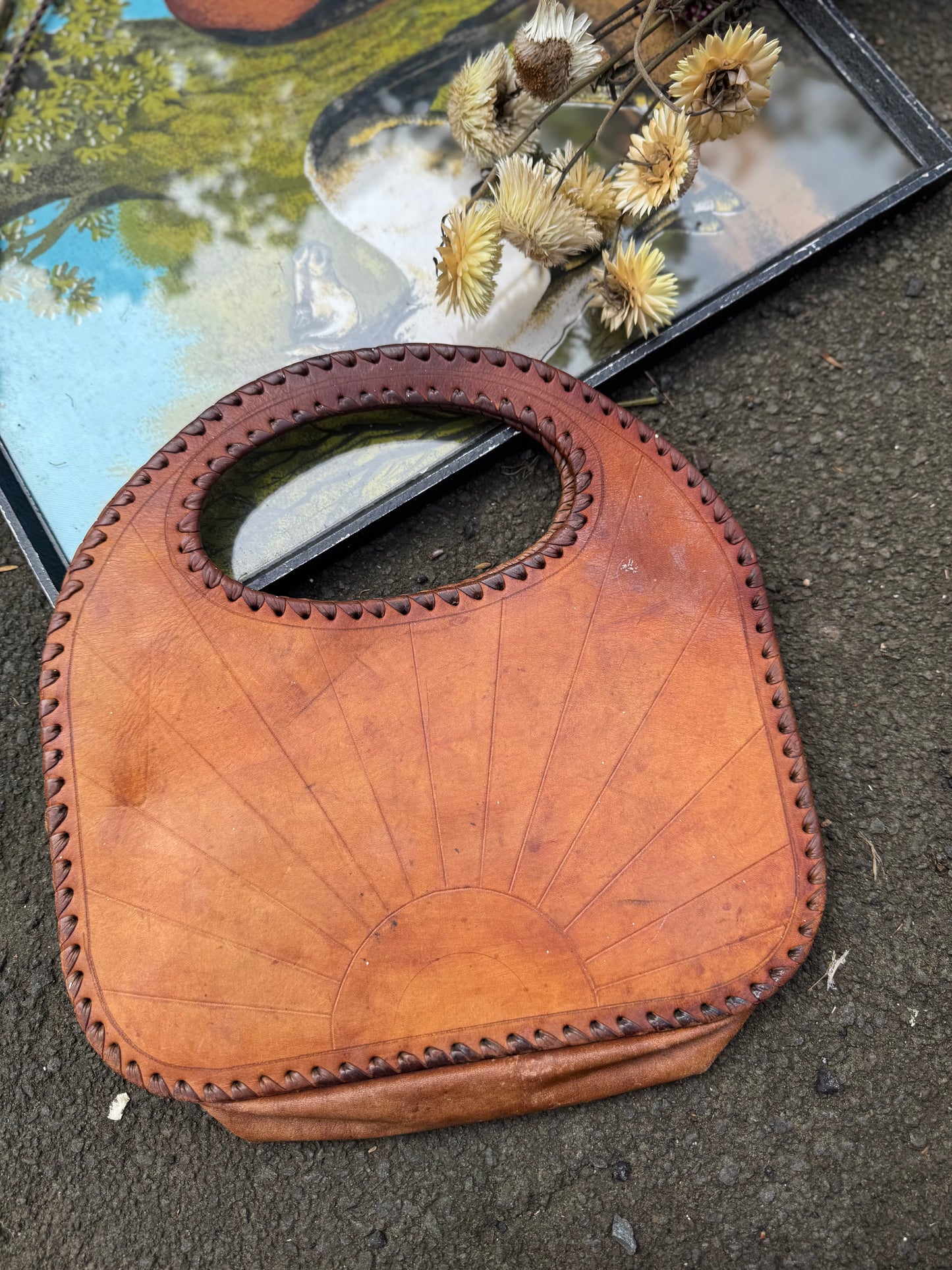 Star burst sun leather tooled bag